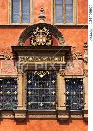 Renaissance tripartite window on Prague Old Town Hall featuring the Latin inscription Praga caput regni and the Old Town coat of arms on a historic stone facade, Prague, Czech republic Renaissance tripartite window on Prague Old Town Hall featuring the Latin inscription Praga caput regni and the Old Town coat of arms on a historic stone facade, Prague, Czech republic 134496604