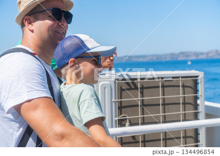 Family enjoying sea view during ferry crossing. Summer travel and lifestyle moment, Sardinian, La Maddalena, Italy 134496854