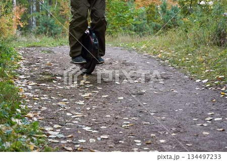man rides down the trail on a monocycle. close up unicycle. 134497233