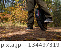 man rides down the trail on a monocycle. close up unicycle. 134497319