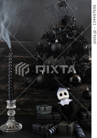 Goth Christmas Still Life with Dark Holiday Gifts and Gothic Doll. Copy space. Vertical shots Goth Christmas Still Life with Dark Holiday Gifts and Gothic Doll. Copy space. Vertical shots 134497698