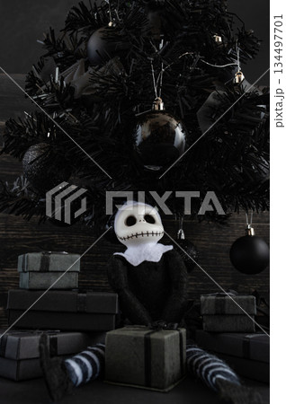 Goth Christmas Still Life with Dark Holiday Gifts and Gothic Doll. Copy space. Vertical shots Goth Christmas Still Life with Dark Holiday Gifts and Gothic Doll. Copy space. Vertical shots 134497701