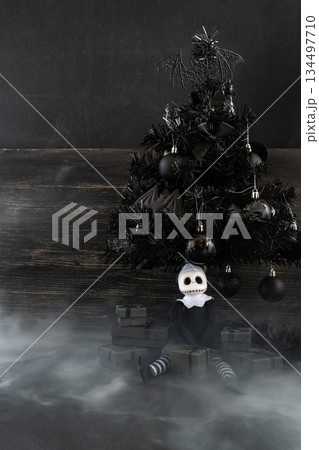 Goth Christmas Still Life with Dark Holiday Gifts and Gothic Doll. Copy space. Vertical shots Goth Christmas Still Life with Dark Holiday Gifts and Gothic Doll. Copy space. Vertical shots 134497710