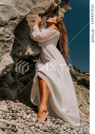 Woman White Dress Rock Climbing Beach 134497910