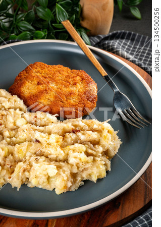 Minced meat cutlet with boiled sauerkraut. Minced meat cutlet with boiled sauerkraut. 134500256