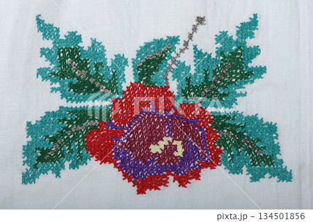 Geometric vintage floral embroidery on white linen fabric Geometric vintage floral embroidery on white linen fabric 134501856