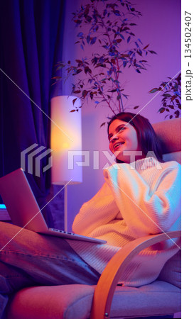 Young woman resting with laptop during work break. Young woman resting with laptop during work break. 134502407