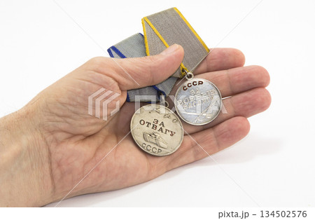 Medals on the palm Medals on the palm 134502576