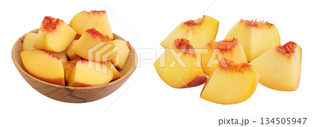 Ripe peach fruit slices in wooden bowl isolated on white background with full depth of field 134505947