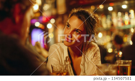 woman in a casual shirt, looking genuinely interested and engagingly at a date or friend in a cozy lit bar or pub. Captures authentic social interaction, first dates, and nightlife lifestyle moments. woman in a casual shirt, looking genuinely interested and engagingly at a date or friend in a cozy lit bar or pub. Captures authentic social interaction, first dates, and nightlife lifestyle moments. 134507581