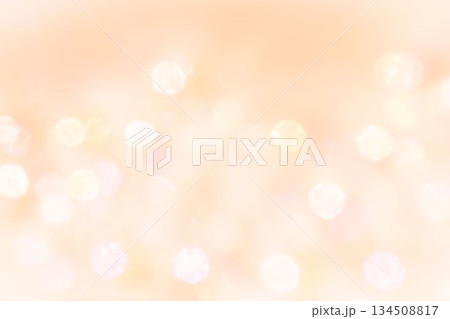 淡いオレンジ色ベージュ　ふんわりキラキラなグラデーション背景テクスチャー素材 134508817