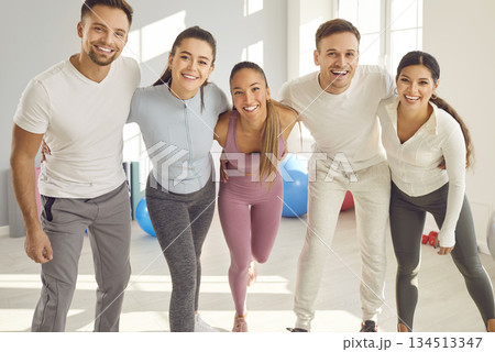 Group portrait of healthy happy friends, health centre and fitness club sporty people with fit coach Group portrait of healthy happy friends, health centre and fitness club sporty people with fit coach 134513347