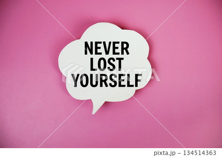 Never Lost Yourself text with speech bubble top view on pink background 134514363