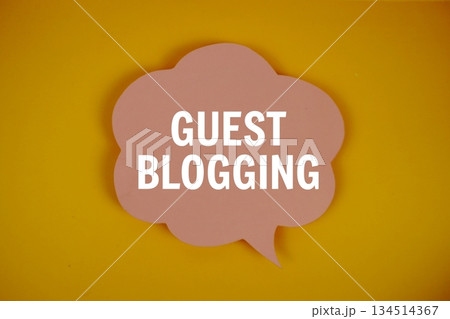 Guest Blogging text with speech bubble top view on yellow background 134514367