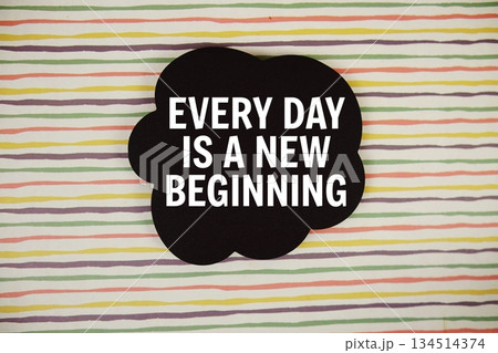 Every Day Is A New Beginning text with speech bubble top view on colorful stripes background Every Day Is A New Beginning text with speech bubble top view on colorful stripes background 134514374