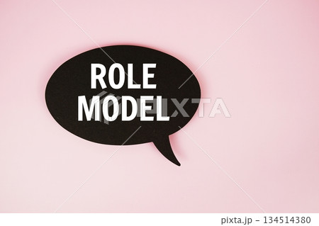 Role Model text with speech bubble top view on pink background Role Model text with speech bubble top view on pink background 134514380