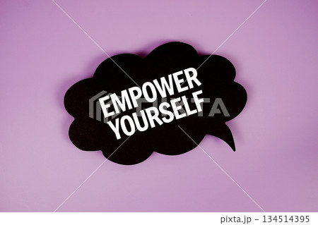 Empower Yourself text with speech bubble top view on purple background 134514395