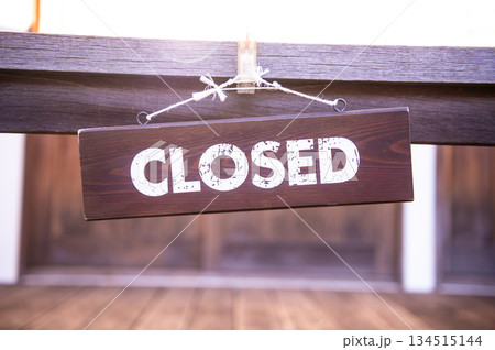 sorry we are closed sign hanging outside a restaurant, store, office or other sorry we are closed sign hanging outside a restaurant, store, office or other 134515144
