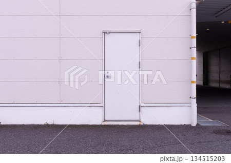 sidewalk by street wall  and  door 134515203
