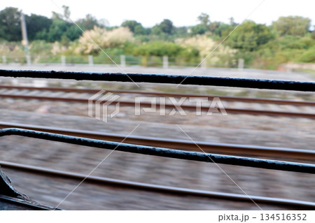 Railway Tracks View from Moving Train Window 134516352