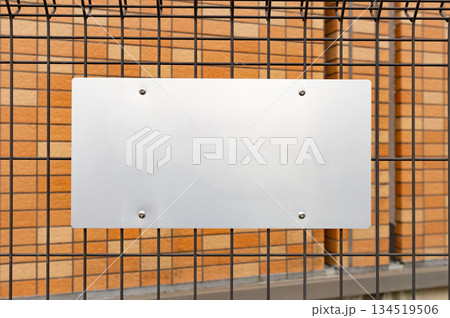 Large blank billboard on a street wall, banners with room to add your own text 134519506