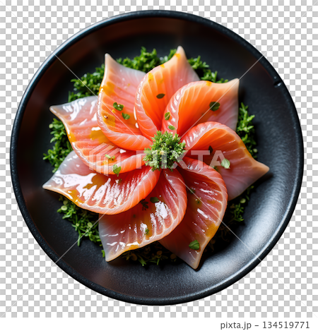 Beautiful fresh salmon sashimi appetizer dish arranged in delicate flower shape, drizzled with ponzu dressing 134519771