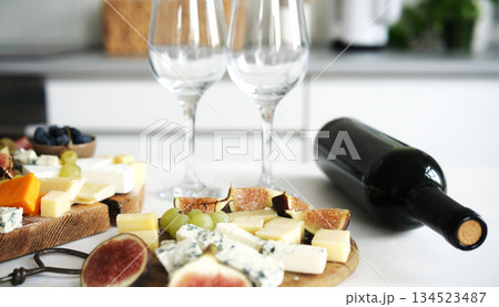 Cheese Board With With Bottle Of Wine On A Table 134523487