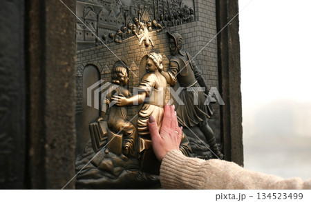 Tourist Hands Touching Bronze Girl For Luck 134523499