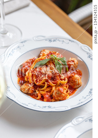 Spaghetti with meatballs in tomato sauce 134524315