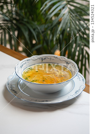 Classic chicken noodle soup with herbs Classic chicken noodle soup with herbs 134524321