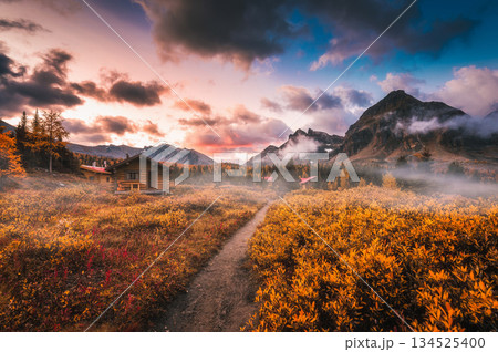 Alpine landscape of wooden huts with rocky mountains on autumn wilderness at Assiniboine, Canada 134525400