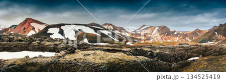 Scenic view of Landmannalaugar with volcanic mountain, black lava moss in Highlands of Iceland Scenic view of Landmannalaugar with volcanic mountain, black lava moss in Highlands of Iceland 134525419