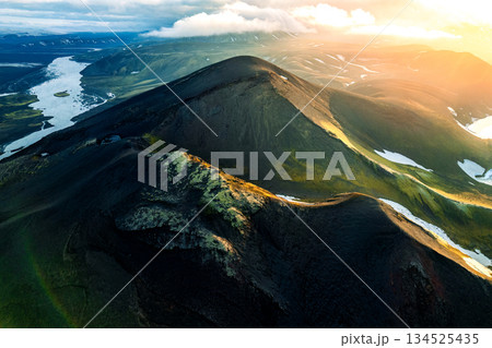Scenic sunset over volcanic terrain and river on wilderness during summer in Iceland 134525435