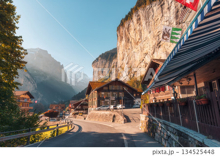 Picturesque rustic Swiss village of Lauterbrunnen valley and Staubbach falls at Canton of Bern, Switzerland Picturesque rustic Swiss village of Lauterbrunnen valley and Staubbach falls at Canton of Bern, Switzerland 134525448