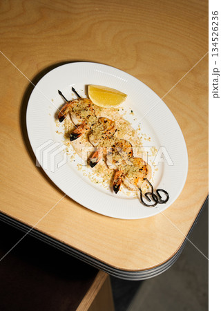 Elegant Seafood Presentation, Refined Appetizer Featuring Shrimp On Skewers With Balsamic And Lemon Elegant Seafood Presentation, Refined Appetizer Featuring Shrimp On Skewers With Balsamic And Lemon 134526236
