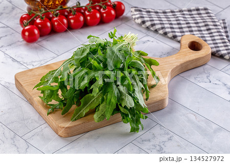 Raw green fresh arugula heap 134527972