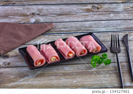 Wrapped ham and cheese roll Wrapped ham and cheese roll 134527981