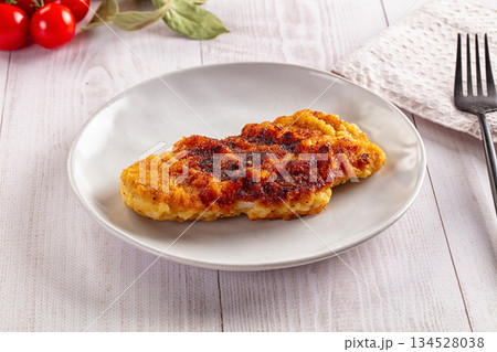 Roasted breaded crispy pork schnitzel Roasted breaded crispy pork schnitzel 134528038