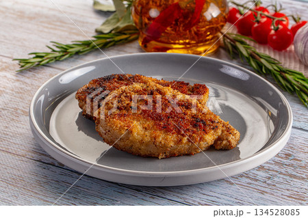 Breaded meat fillet escalope schnitzel Breaded meat fillet escalope schnitzel 134528085