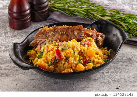 Couscous with ribs and vegetables Couscous with ribs and vegetables 134528142