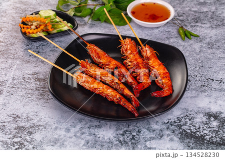 Grilled prawn skewer served sauce 134528230