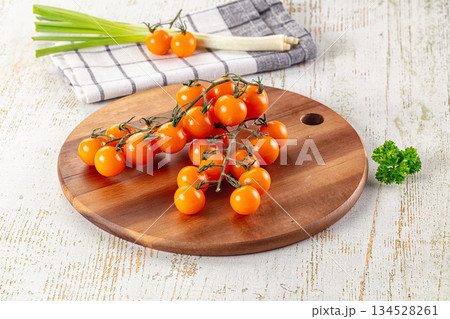 Ripe juicy yellow cherry tomatoes 134528261