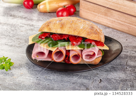 Ciabatta with mortadella, tomato, cheese and spinach Ciabatta with mortadella, tomato, cheese and spinach 134528333