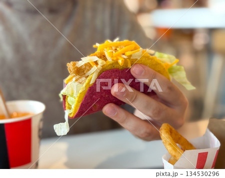 Mexican pork tacos with vegetables on hand close-up 134530296