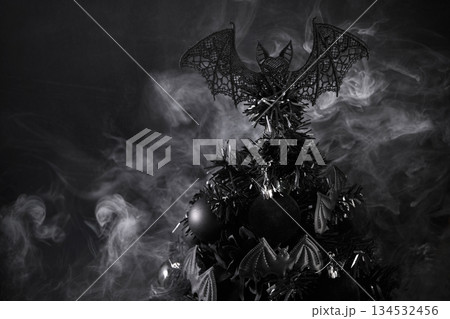 Gothic Christmas. A black Christmas tree adorned with dark ornaments and surrounded by mist 134532456
