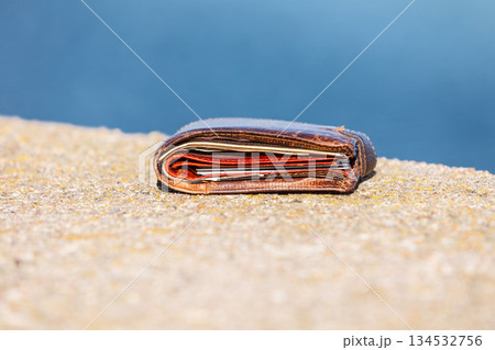 wallet lying unattended outdoor 134532756