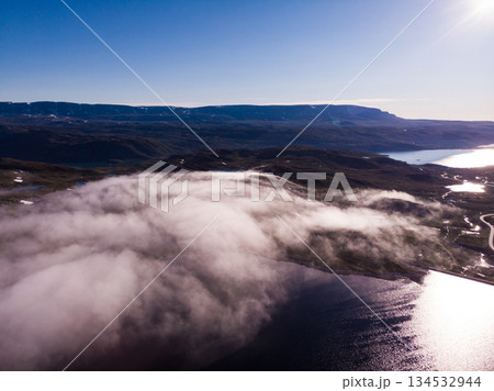 Clouds over lake water, Hardangervidda landscape, Norway Clouds over lake water, Hardangervidda landscape, Norway 134532944