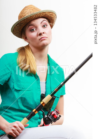 Woman with fishing rod , spinning equipment 134533482