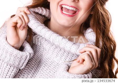 Woman showing her soft turtleneck Woman showing her soft turtleneck 134533674
