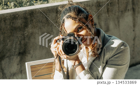 Woman Photographer with Camera 134533869